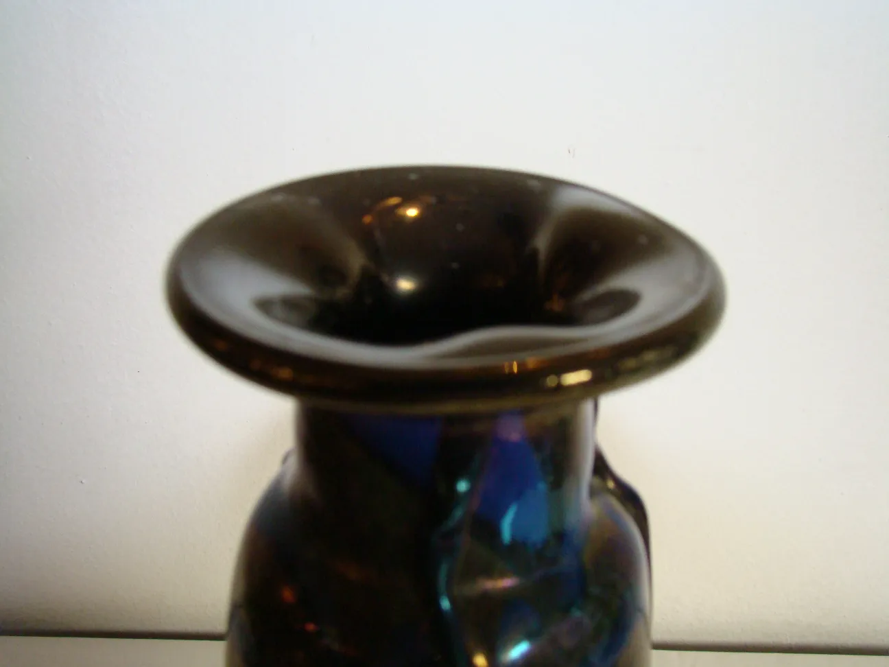 detail of antique signed glass loetz with dark rim and appealing design