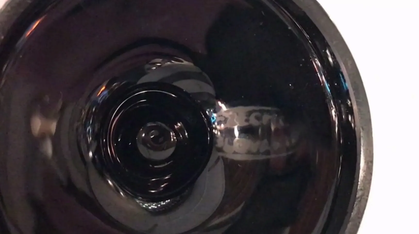 antique glass signed in dark color with visible signature