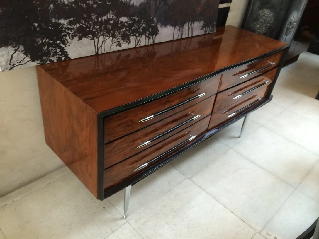 antique bedside table with several drawers, cozy setting