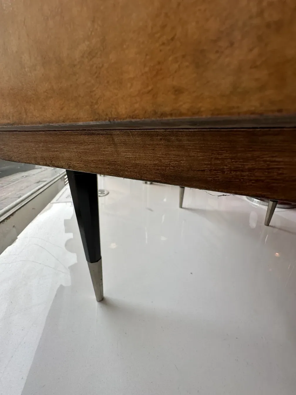 Antique bedside table with visible details, showcases cozy ambiance