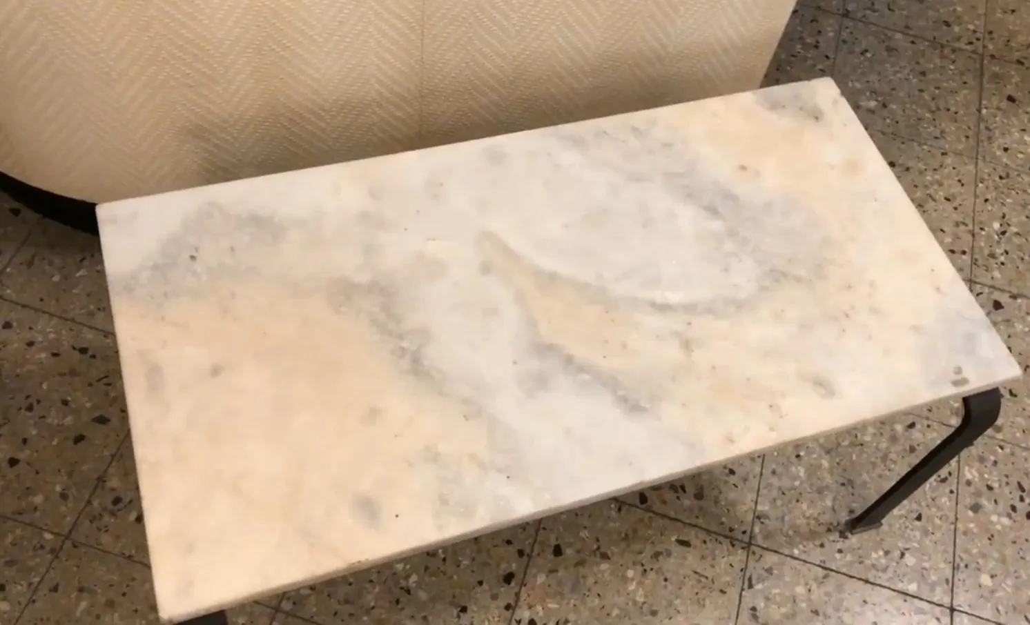 Antique coffee table with a smooth light surface in a cozy setting