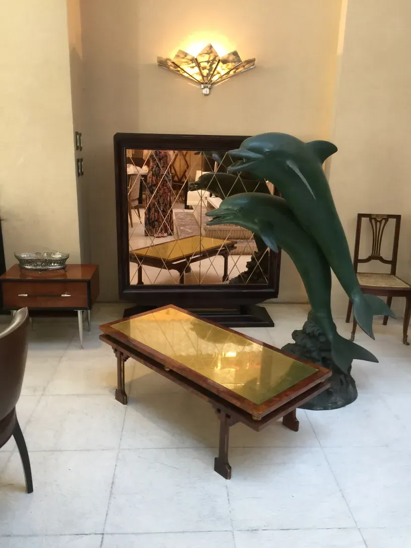 antique coffee table with decorative detail and elegant background