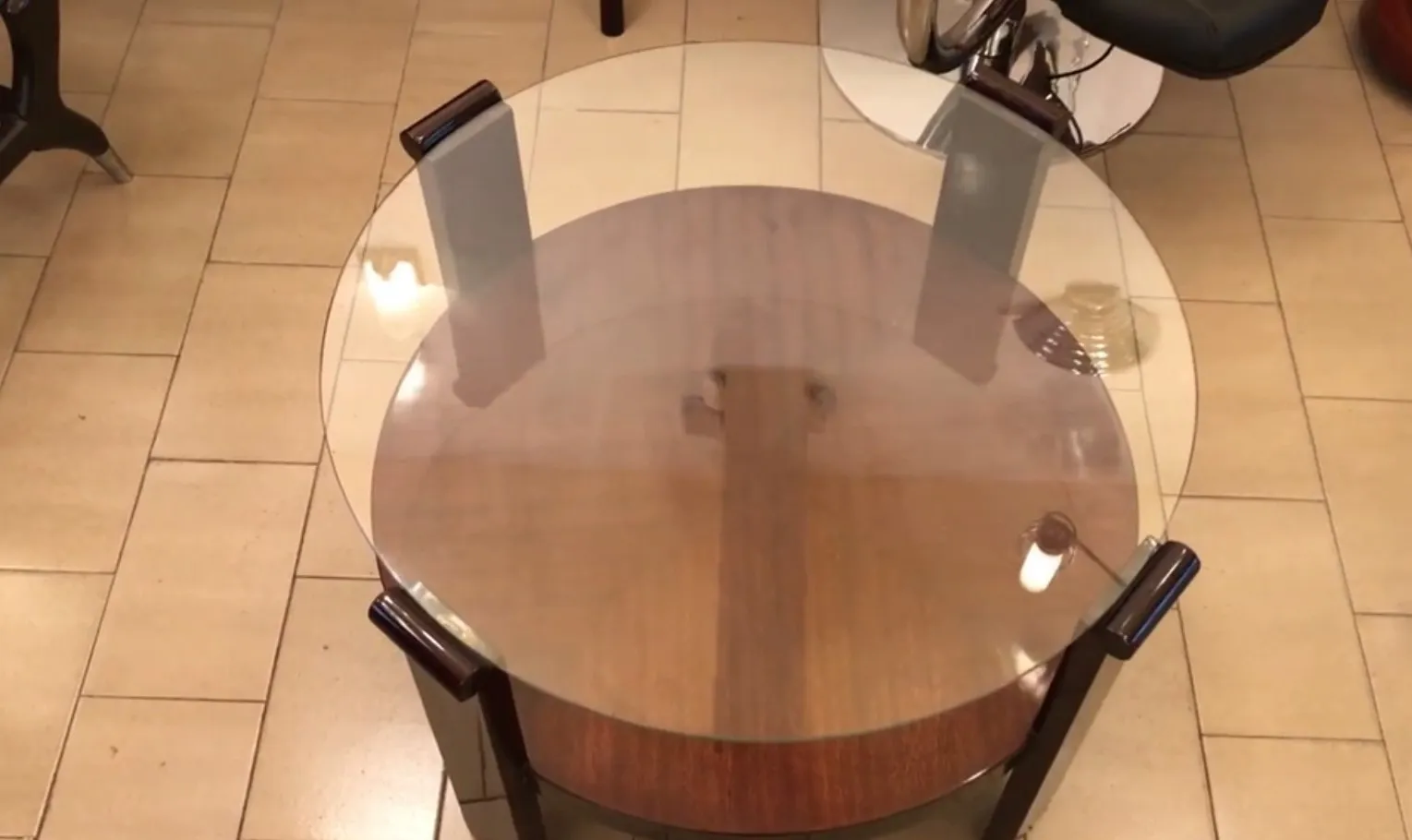 antique round coffee table with glass top in cozy setting