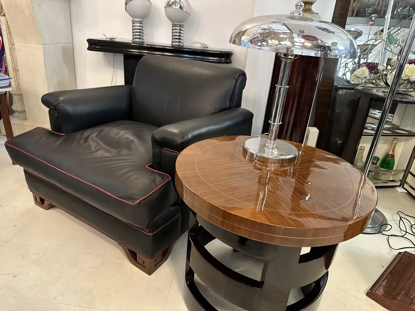 antique round small table in an elegant setting with armchairs