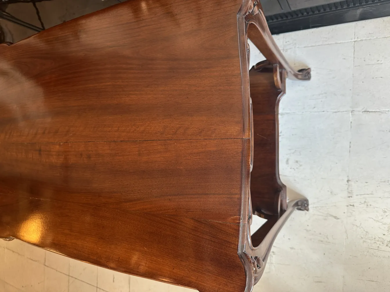 antique small table with an oval shape in a cozy setting