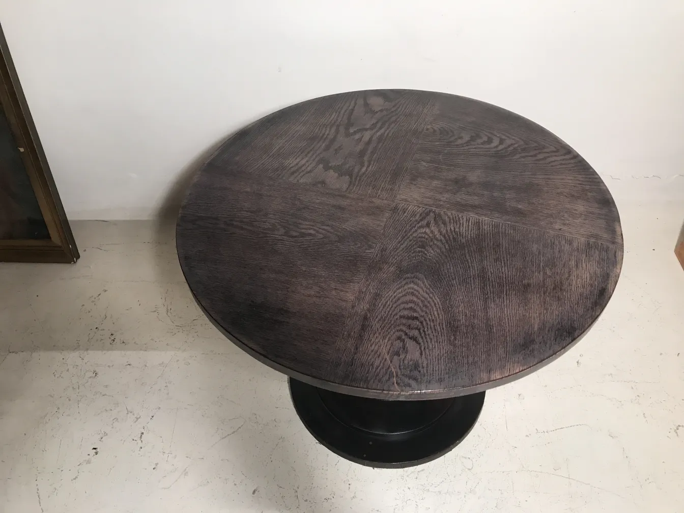 antique round small table with smooth surface and curved edge