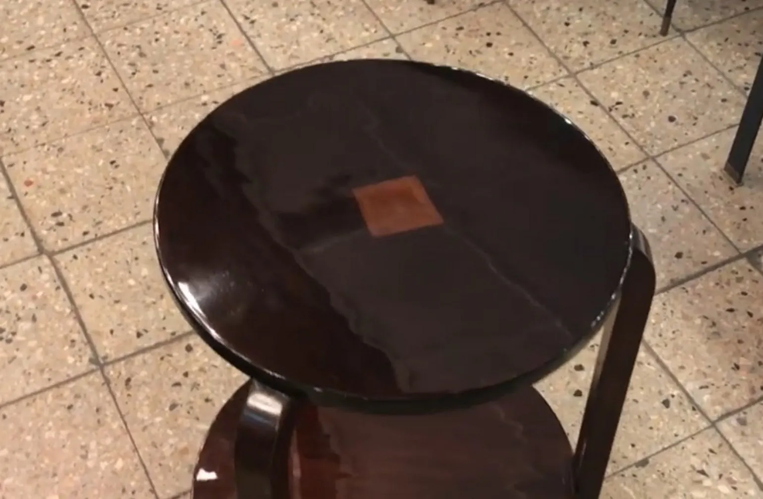 antique small table with a round top and details