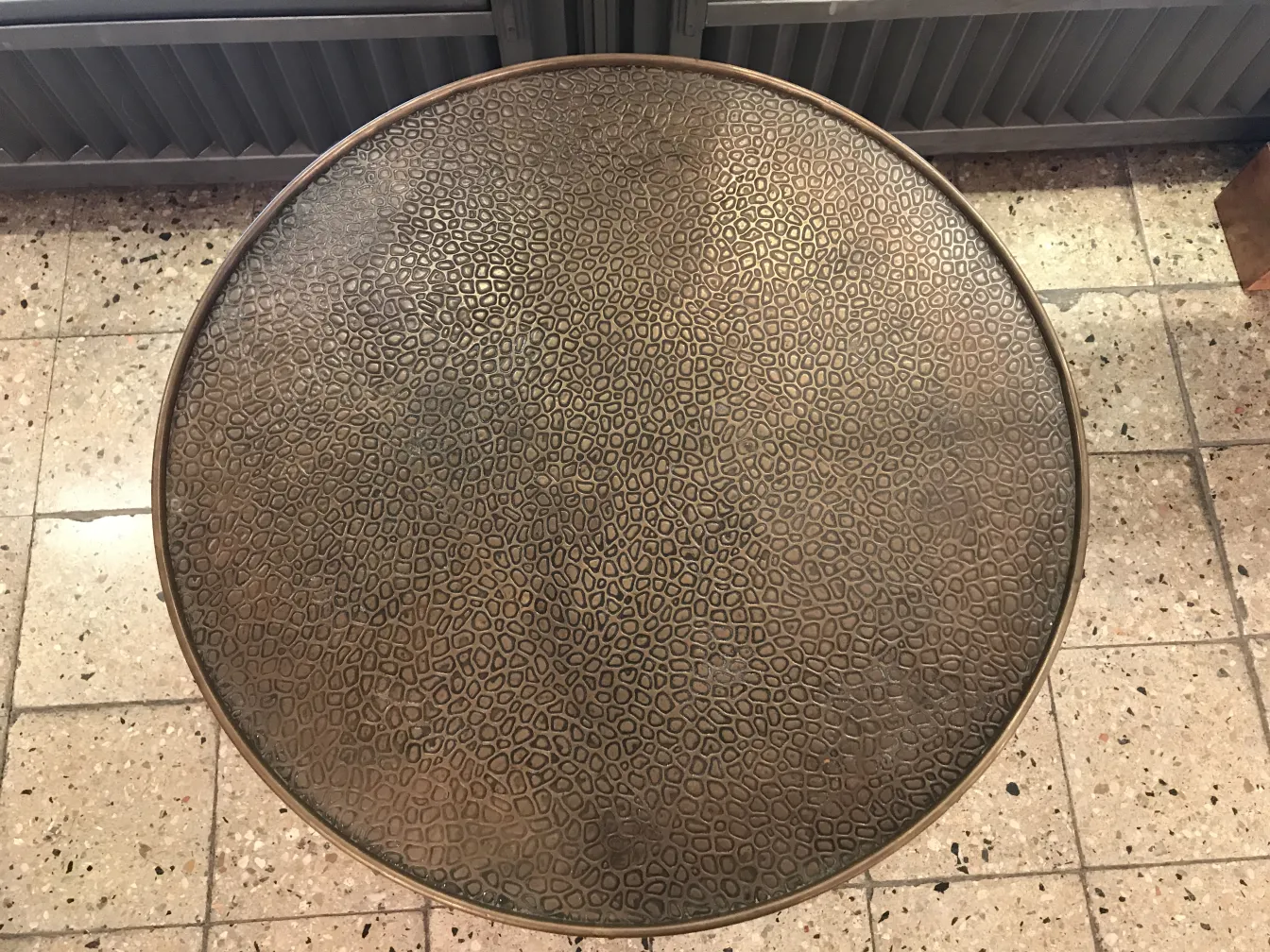 antique round table with textured surface