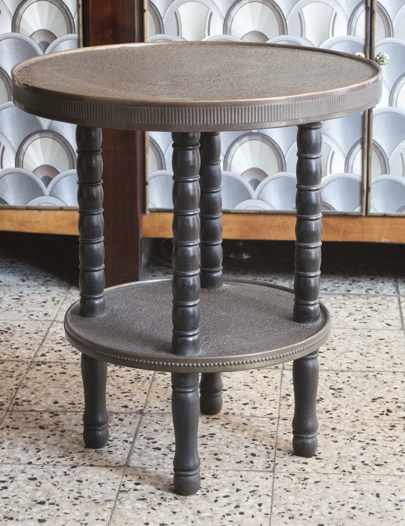 antique round table with a textured top and turned legs, perfect for decor