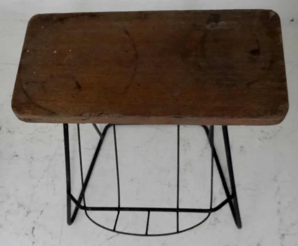 antique small table with wooden surface in a minimalist setting