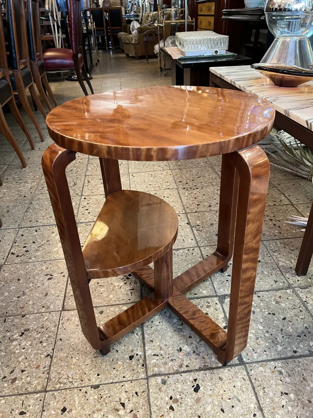 small antique table with elegant legs and subtle decor in a classic setting