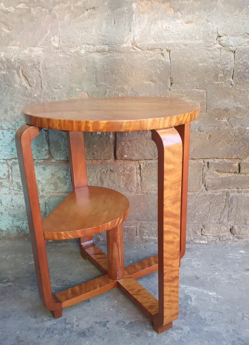 antique small round table set against stone walls