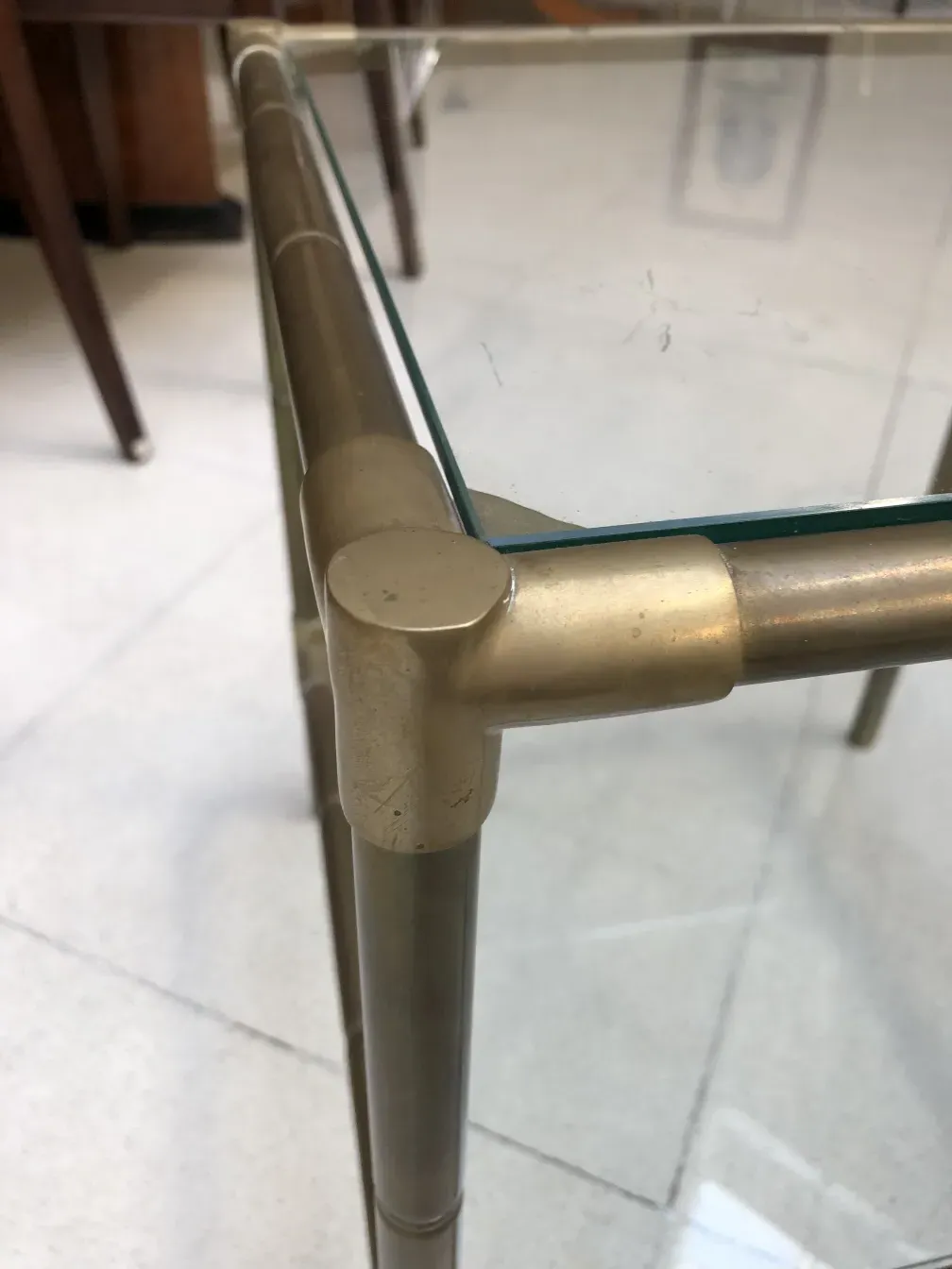 antique small table with metallic frame, light background