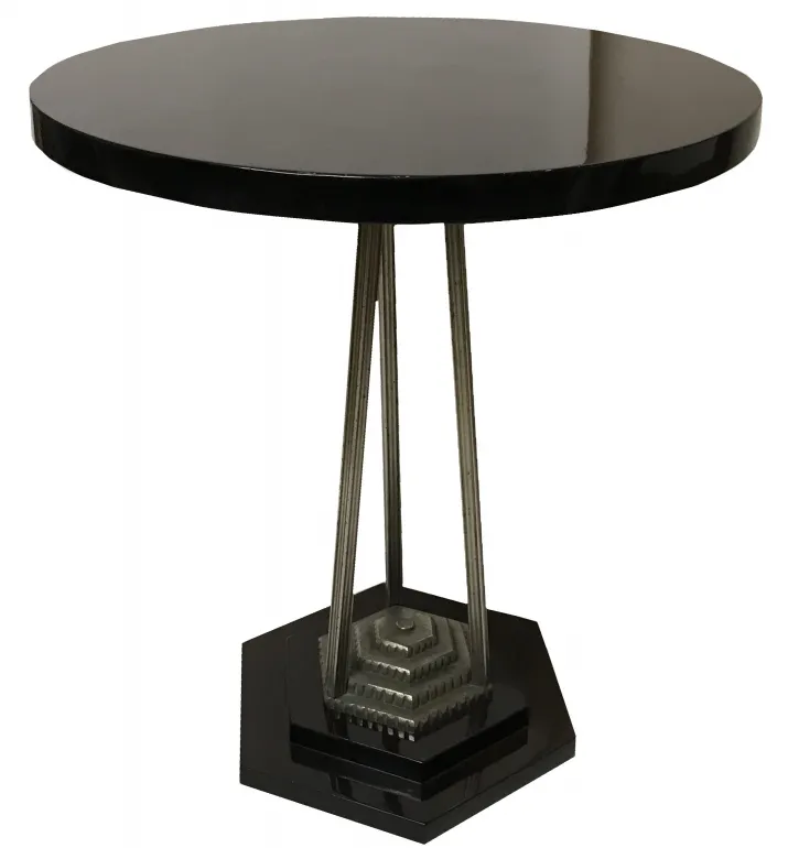 antique small table with decorative base and black surface