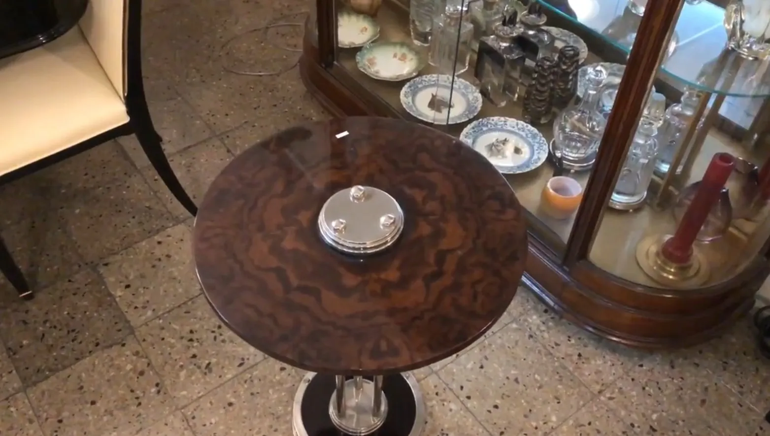 antique small table with elegant decor in background
