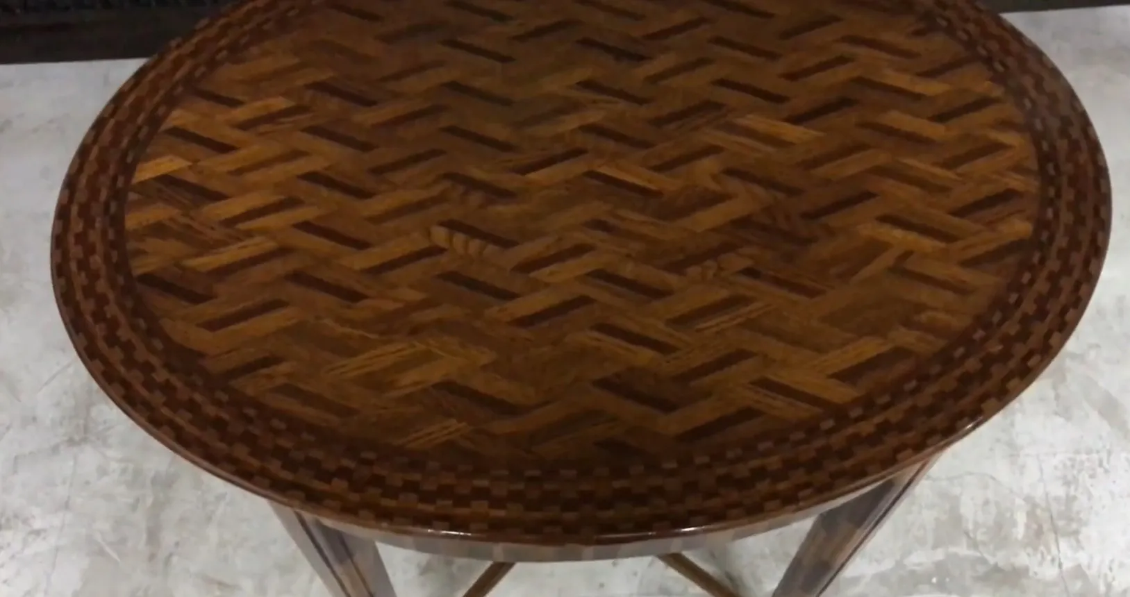 antique round small table with a decorative pattern on the surface