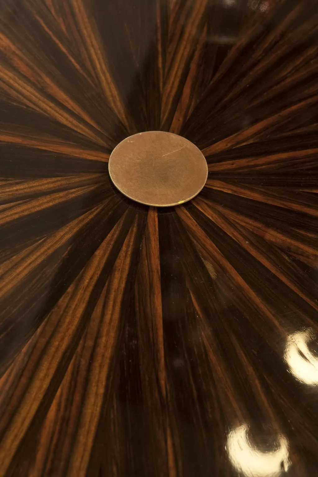 antique small table with radial pattern on surface