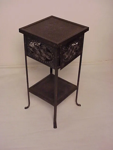 Antique small table with a lattice design, elegant and functional in a neutral setting.
