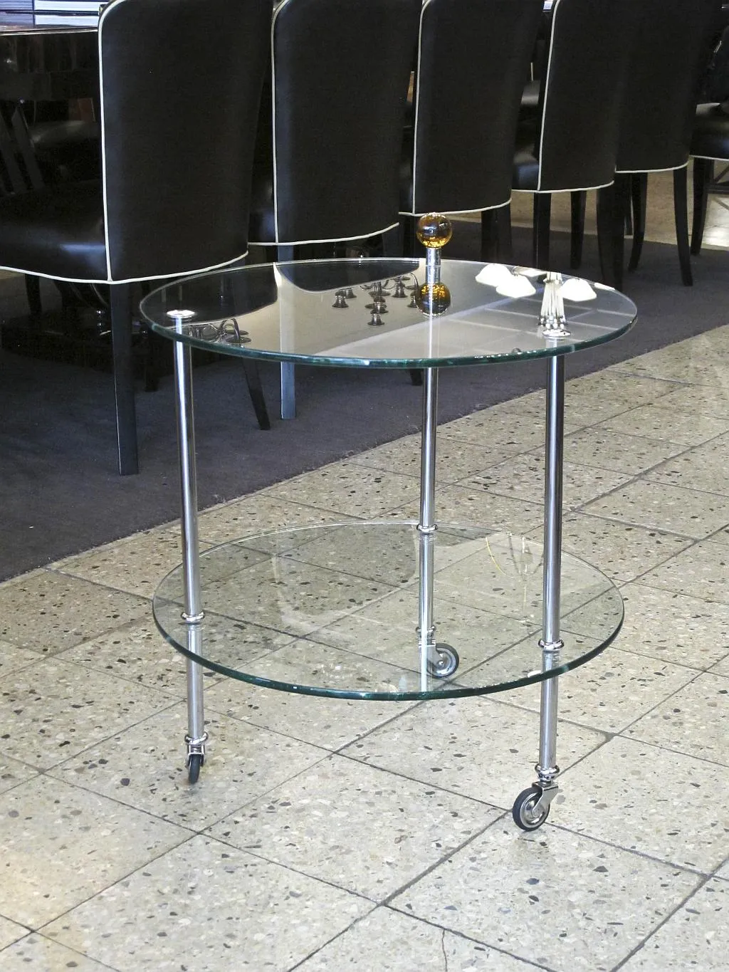 Antique two-tier small table with glass top and wheels