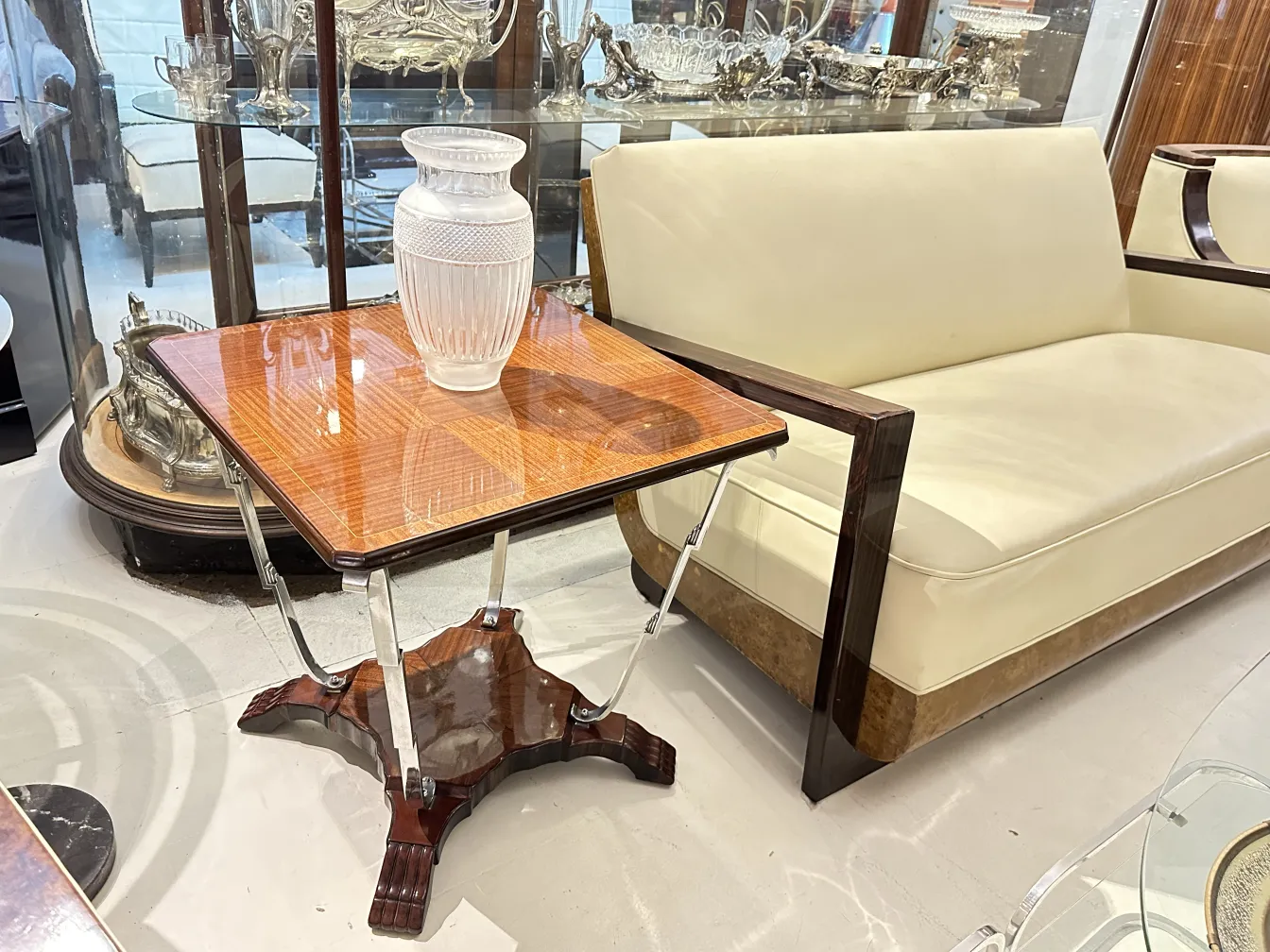 Antique small table with a vase in a bright room.