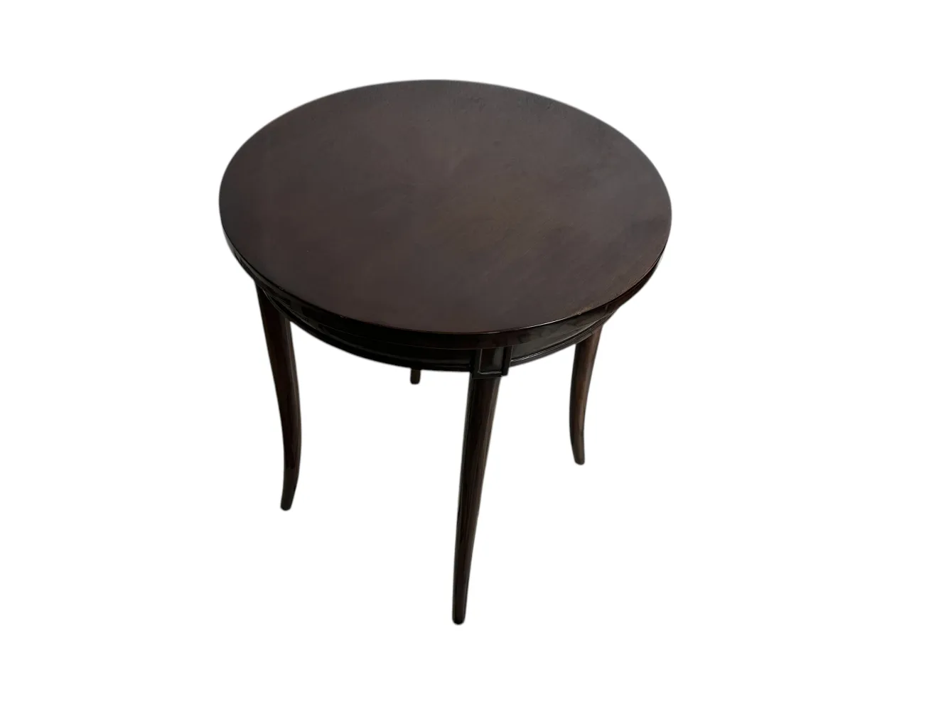 Tavolino antico rotondo con gambe allungate.