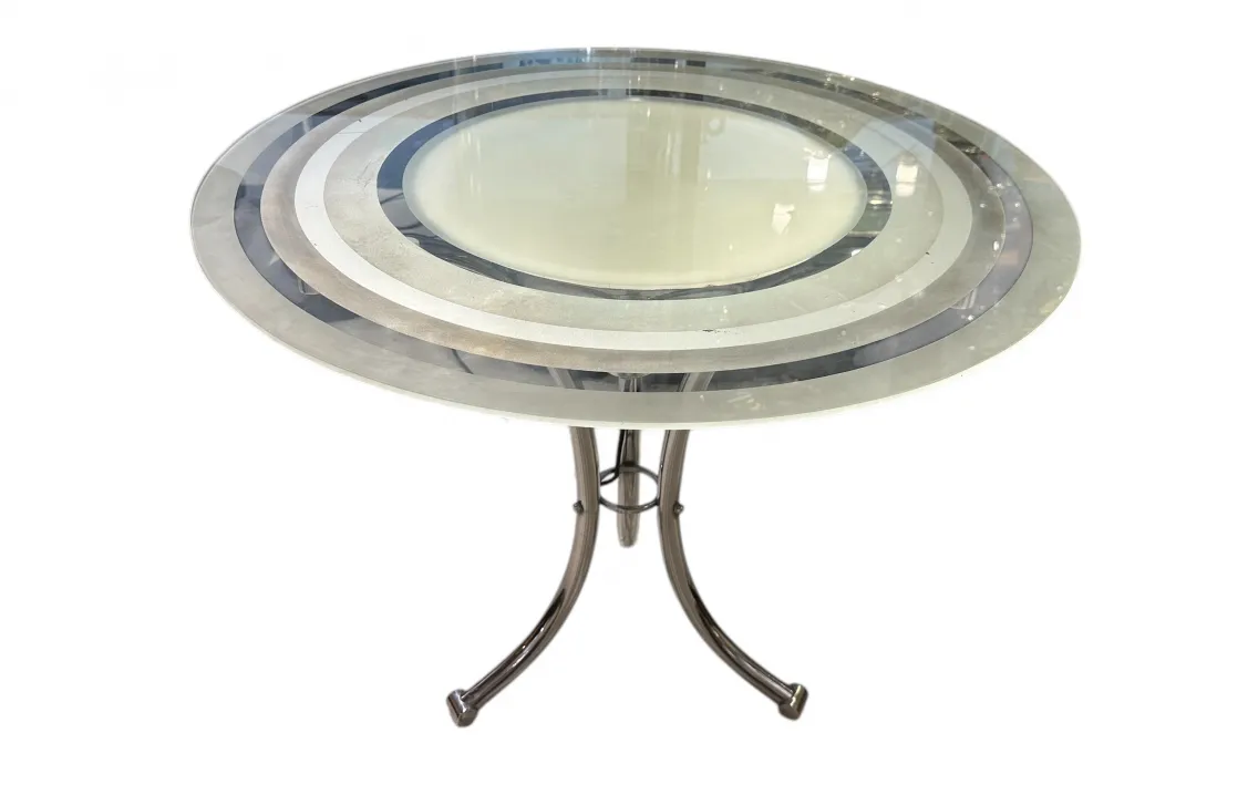 Antique round small table with decorative design, top view.