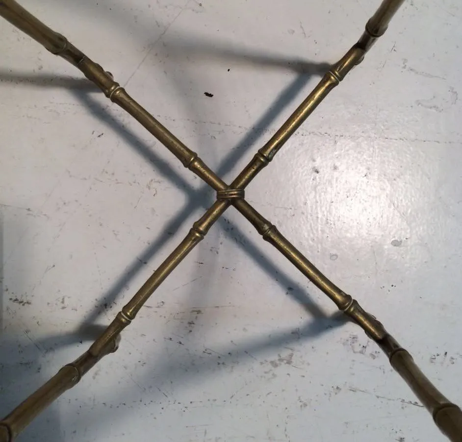 top view of an antique small table with cross legs