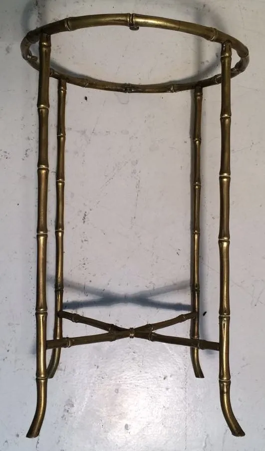 small antique table with thin legs and round shape