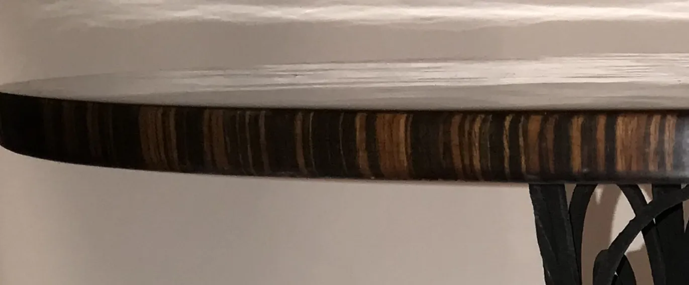 side view of 2 antique decorative small tables