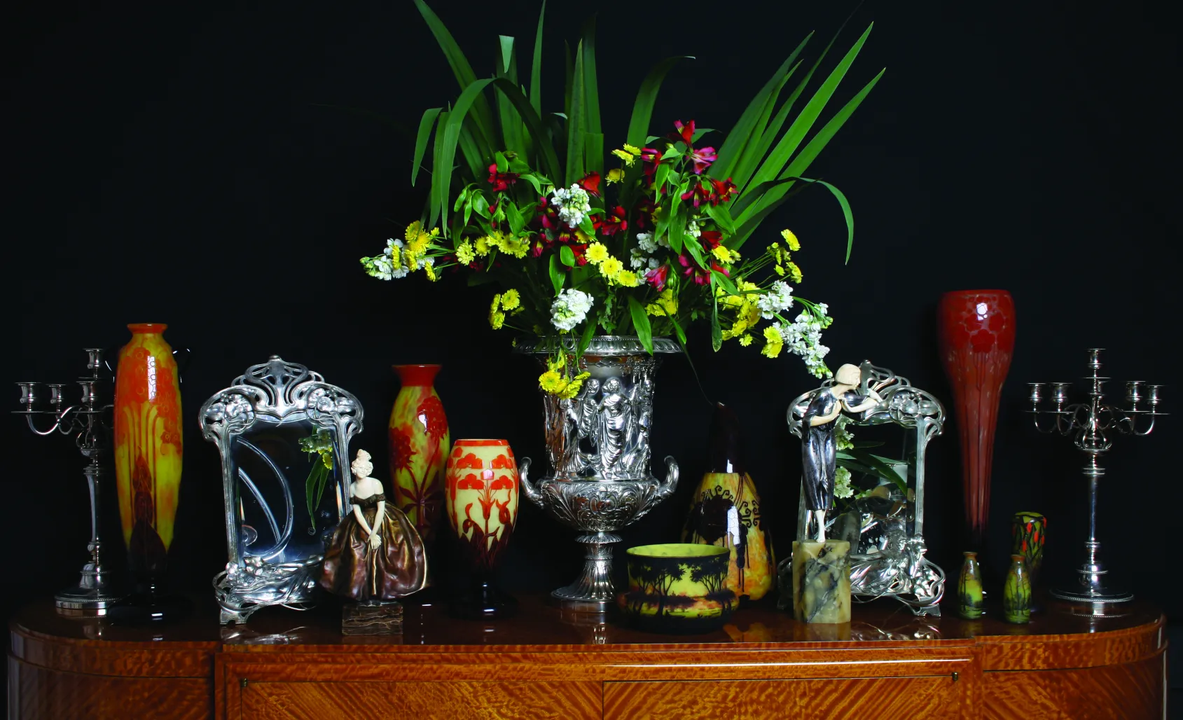 two decorative antique candlesticks with flowers