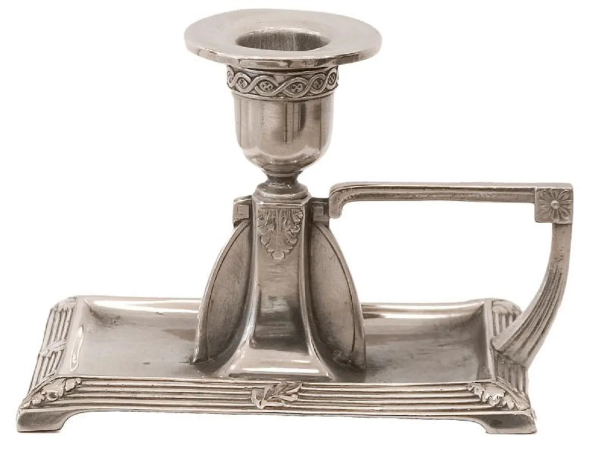 two decorative antique candelabras in a holder