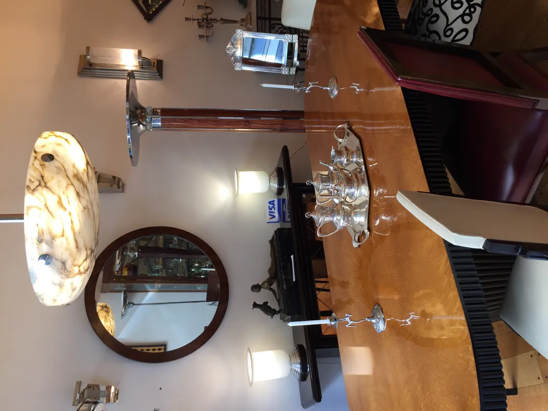Two antique candelabras on an elegant table with a cozy ambiance.