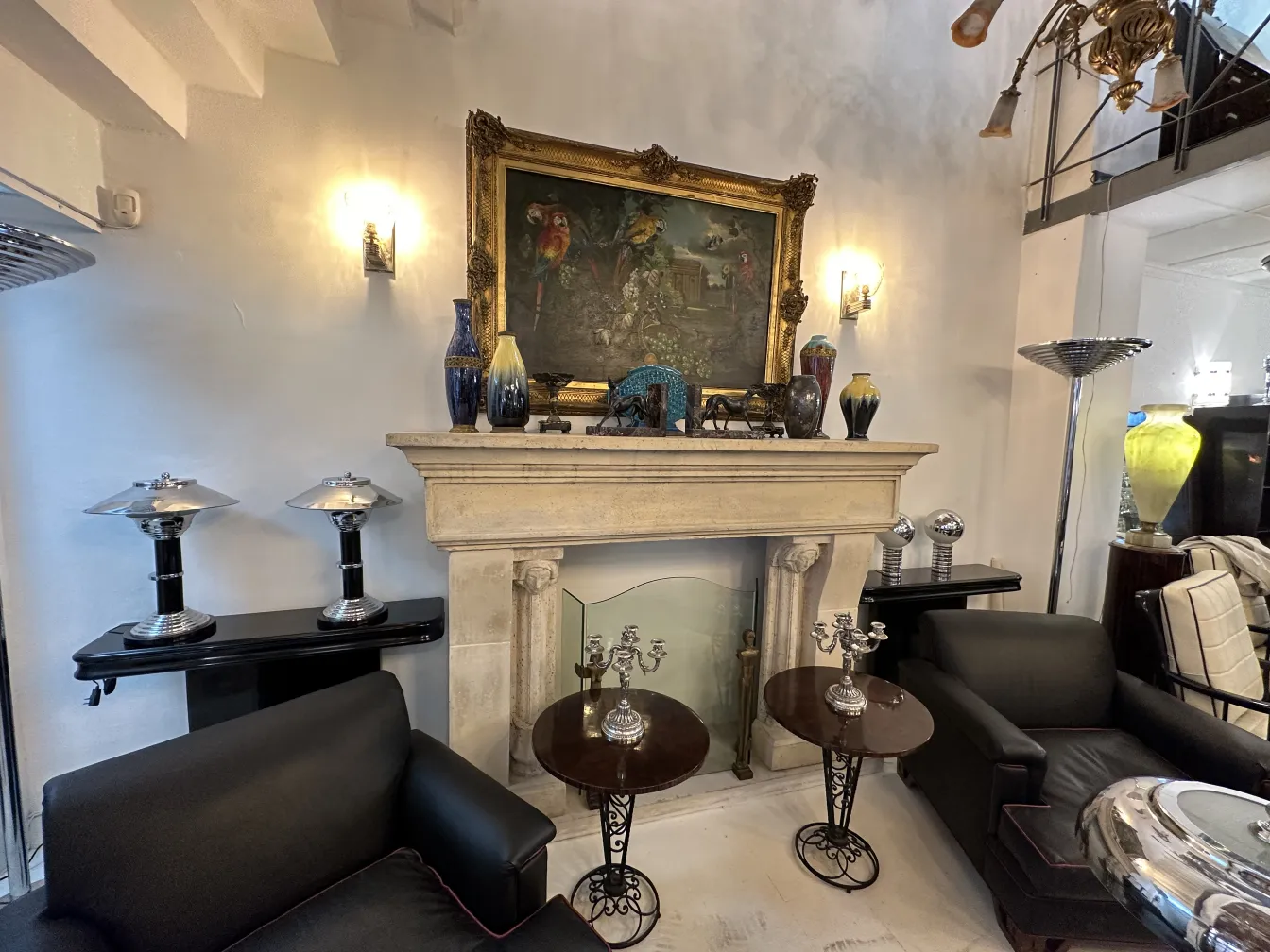 Set of 2 elegant antique candelabras in a bright room.