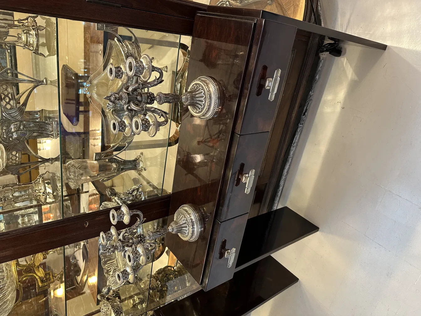 Two antique candelabras displayed elegantly.