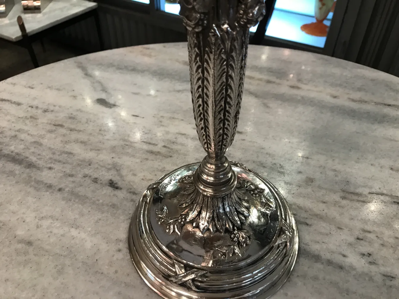 2 antique candelabras with decorative details, art nouveau, on marble table