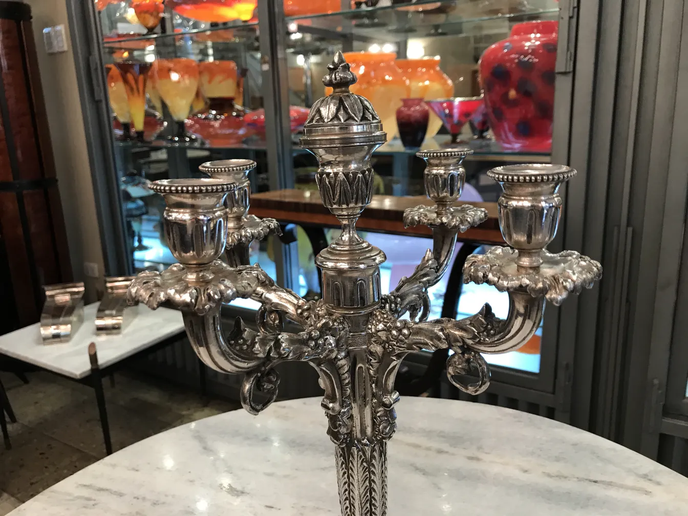 two antique decorative candelabras with elegant details