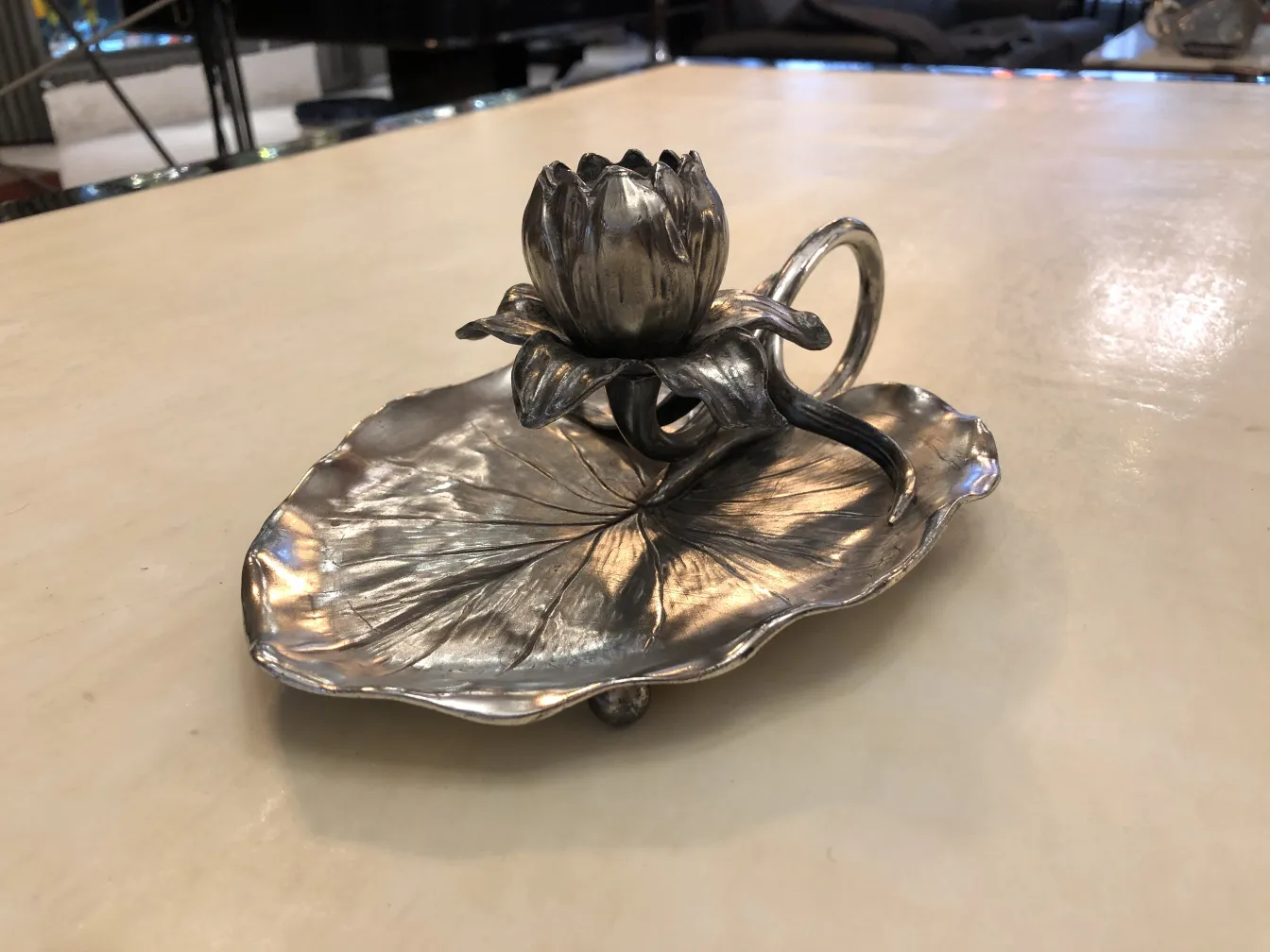 Antique candelabra shaped like a flower and leaf, decorative and elegant