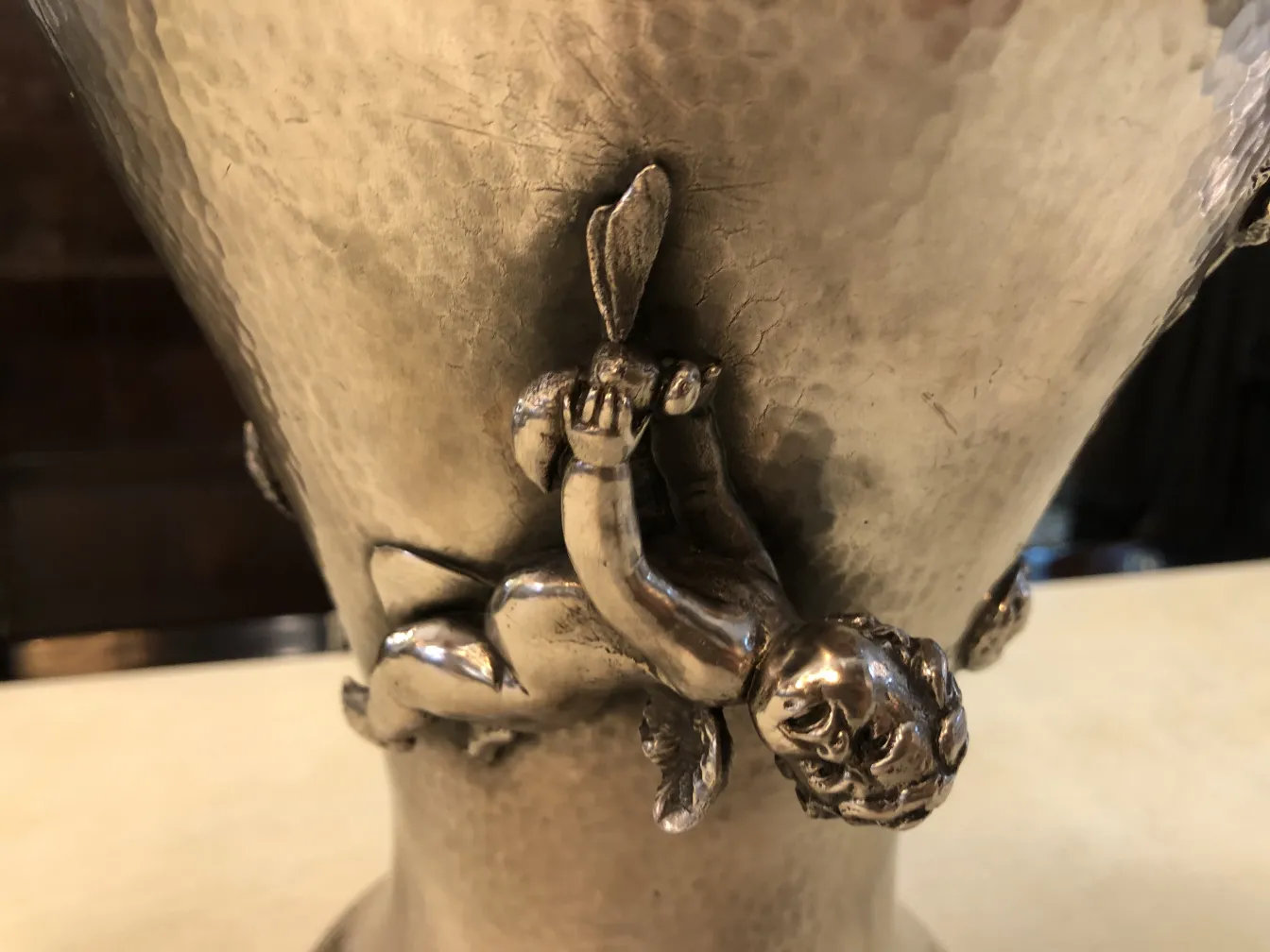 two antique vases with relief decorative figures, classic setting