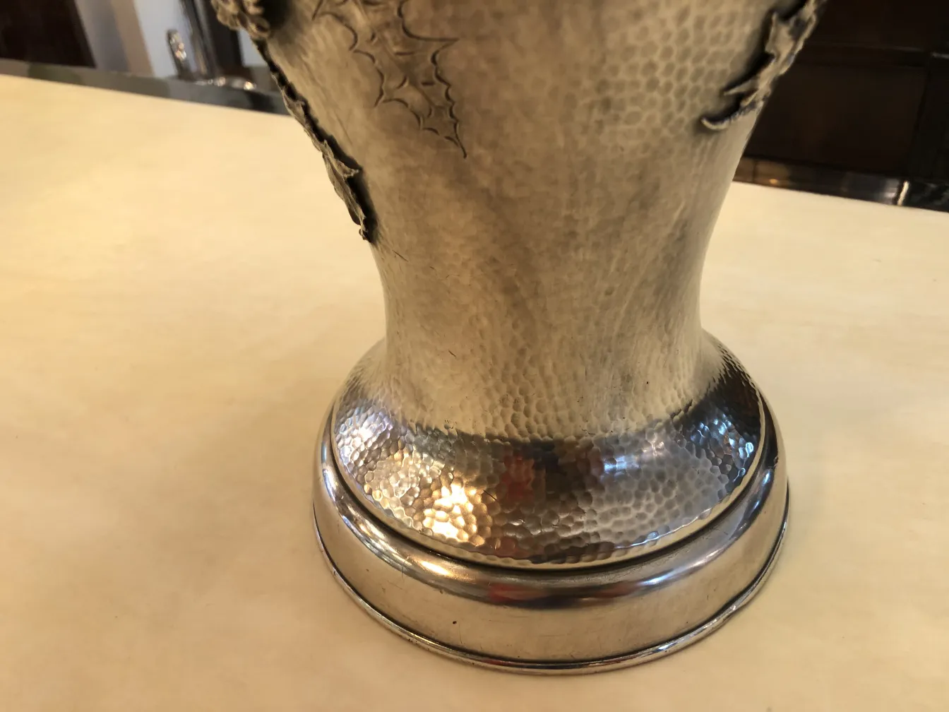 two antique vases in art nouveau style with decorative details on top