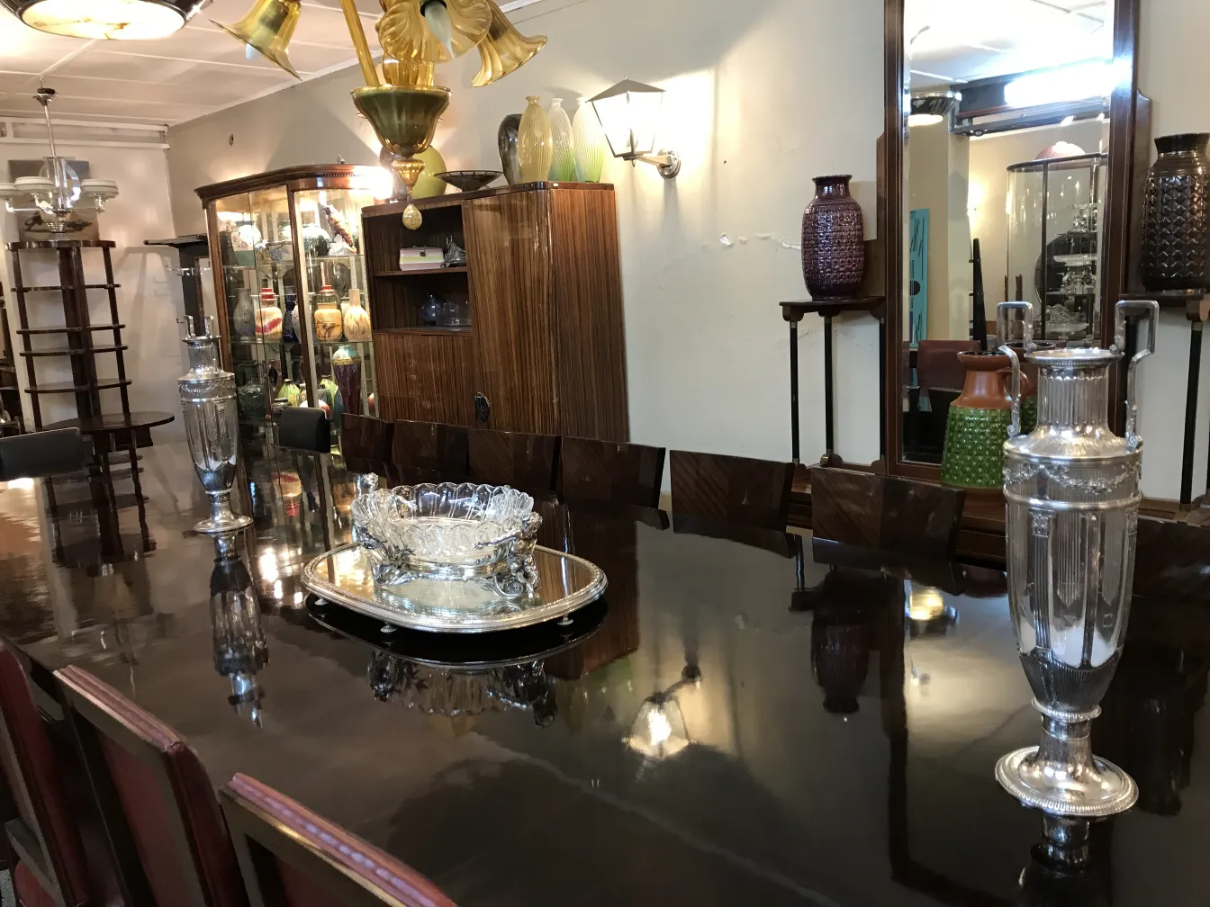 Two antique vases in Art Nouveau style on an elegant table.