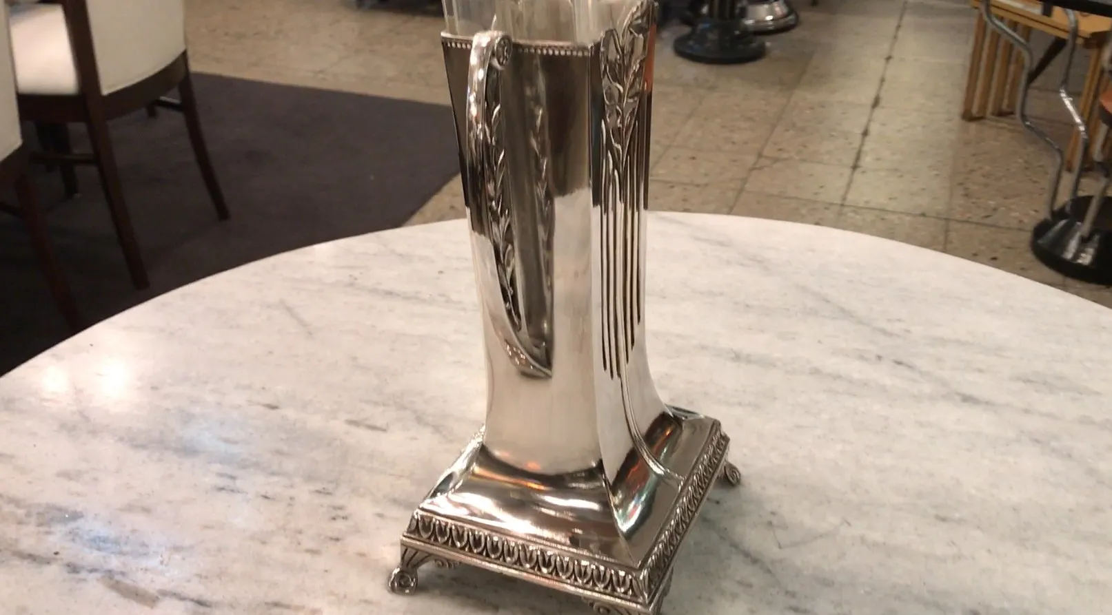 Two antique vases with a shiny, elegant finish, surrounded by a cozy environment.