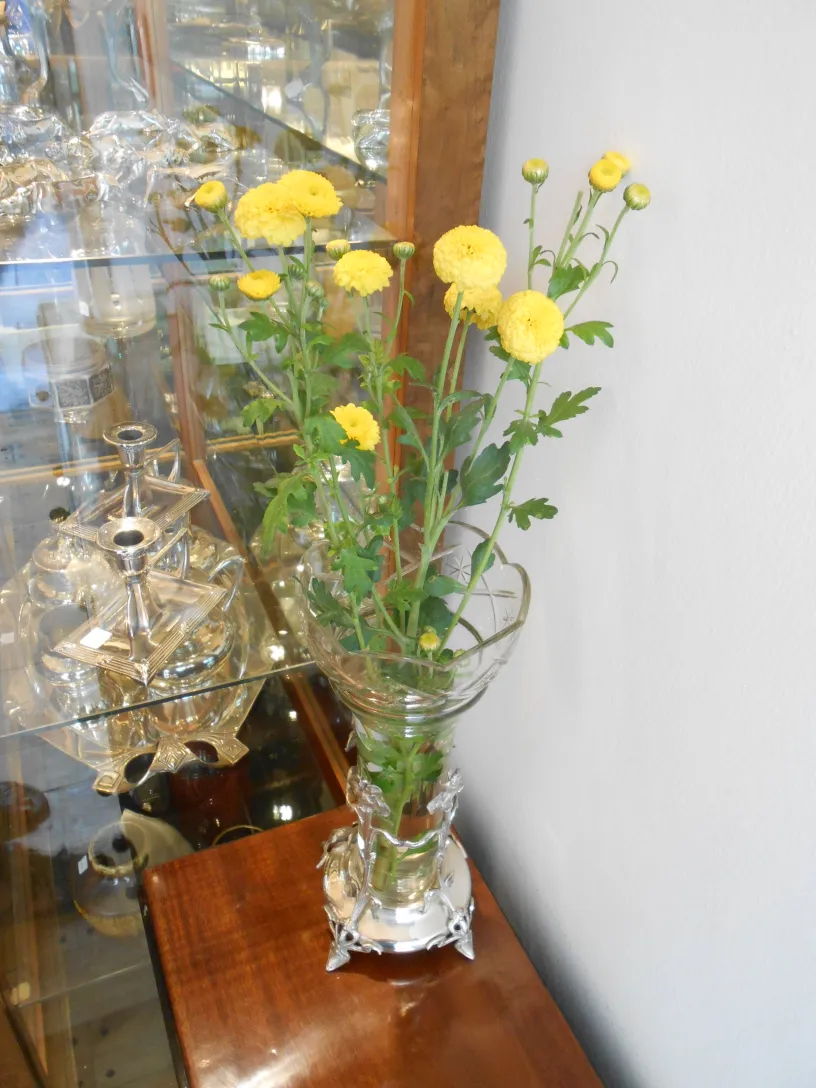 Two antique vases with bright yellow flowers