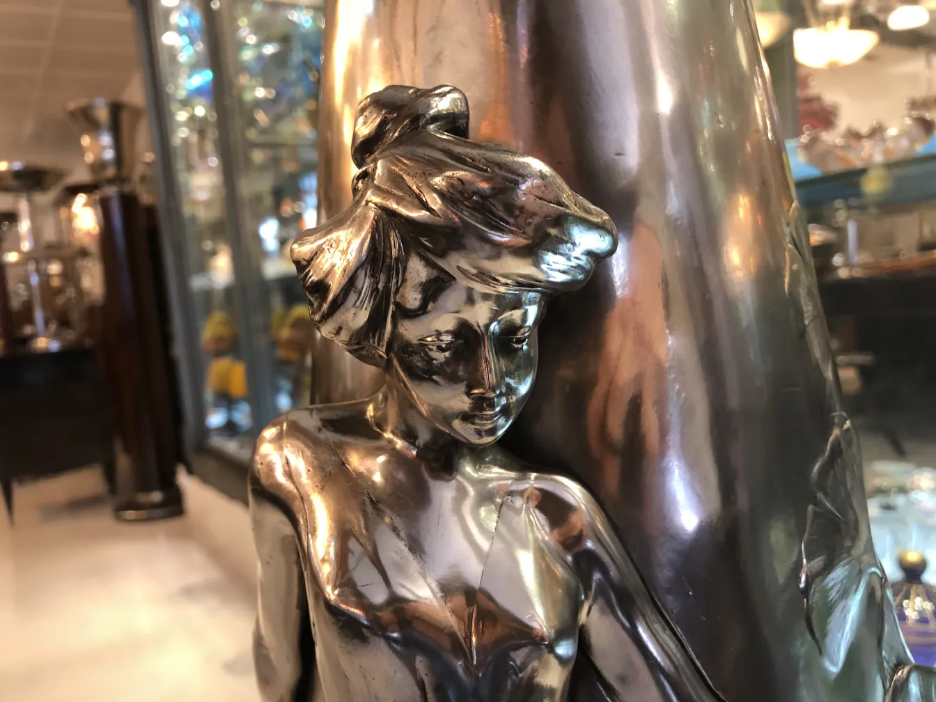 antique vase decorated with a female figure in art nouveau style