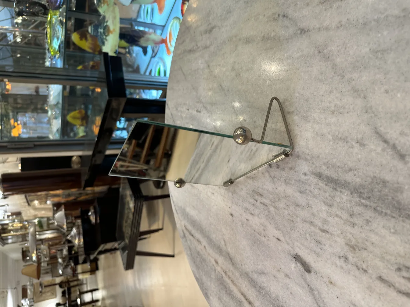 antique mirror with stand, reflecting an elegant environment