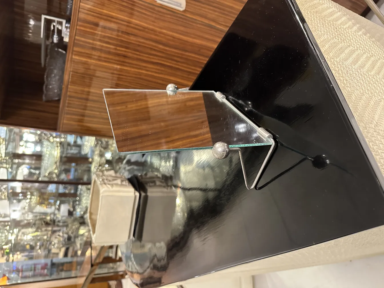 small antique mirror with classic design and stand