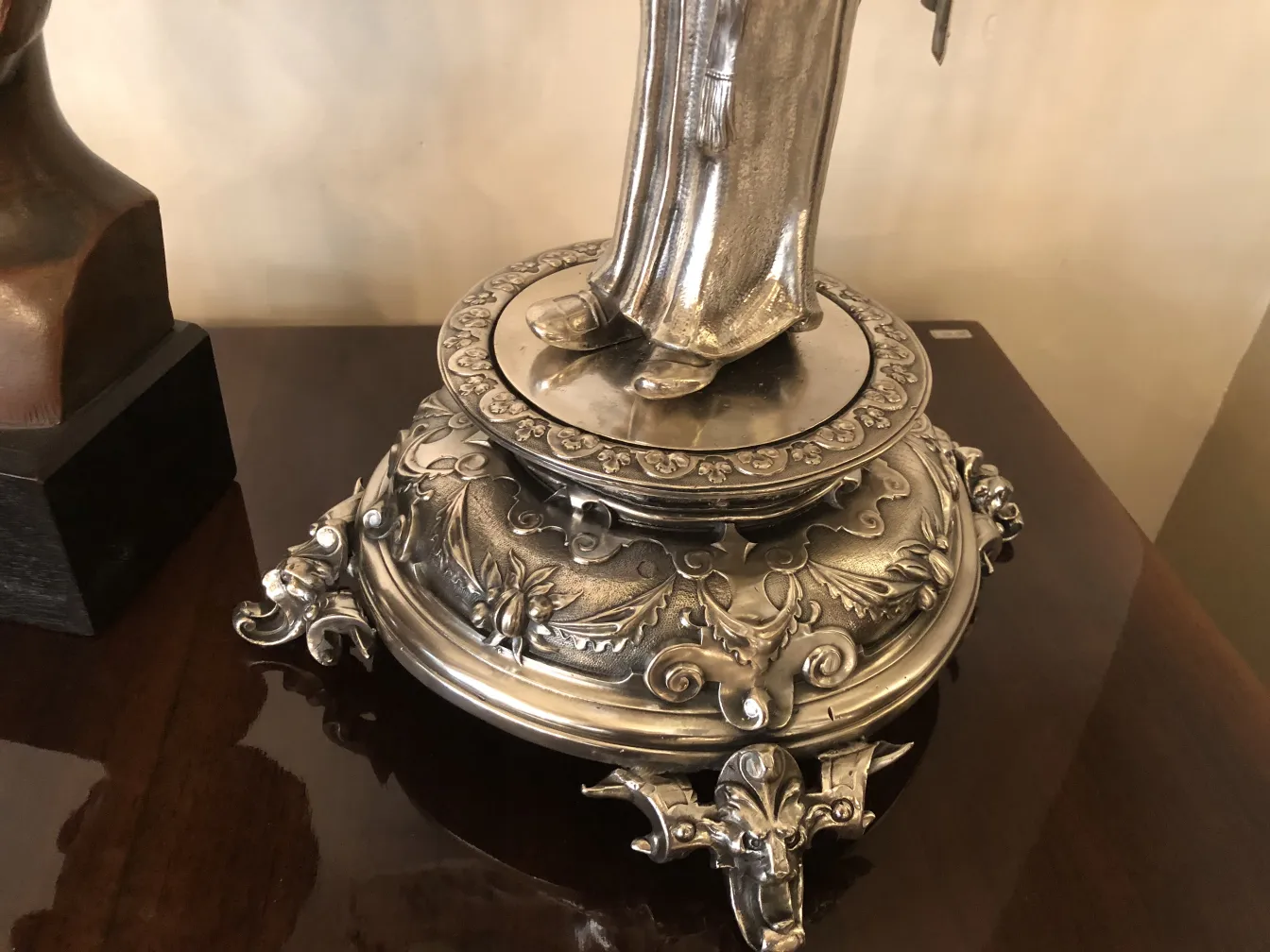 Antique mirror with decorative Art Nouveau base, ornamental style, elegant.