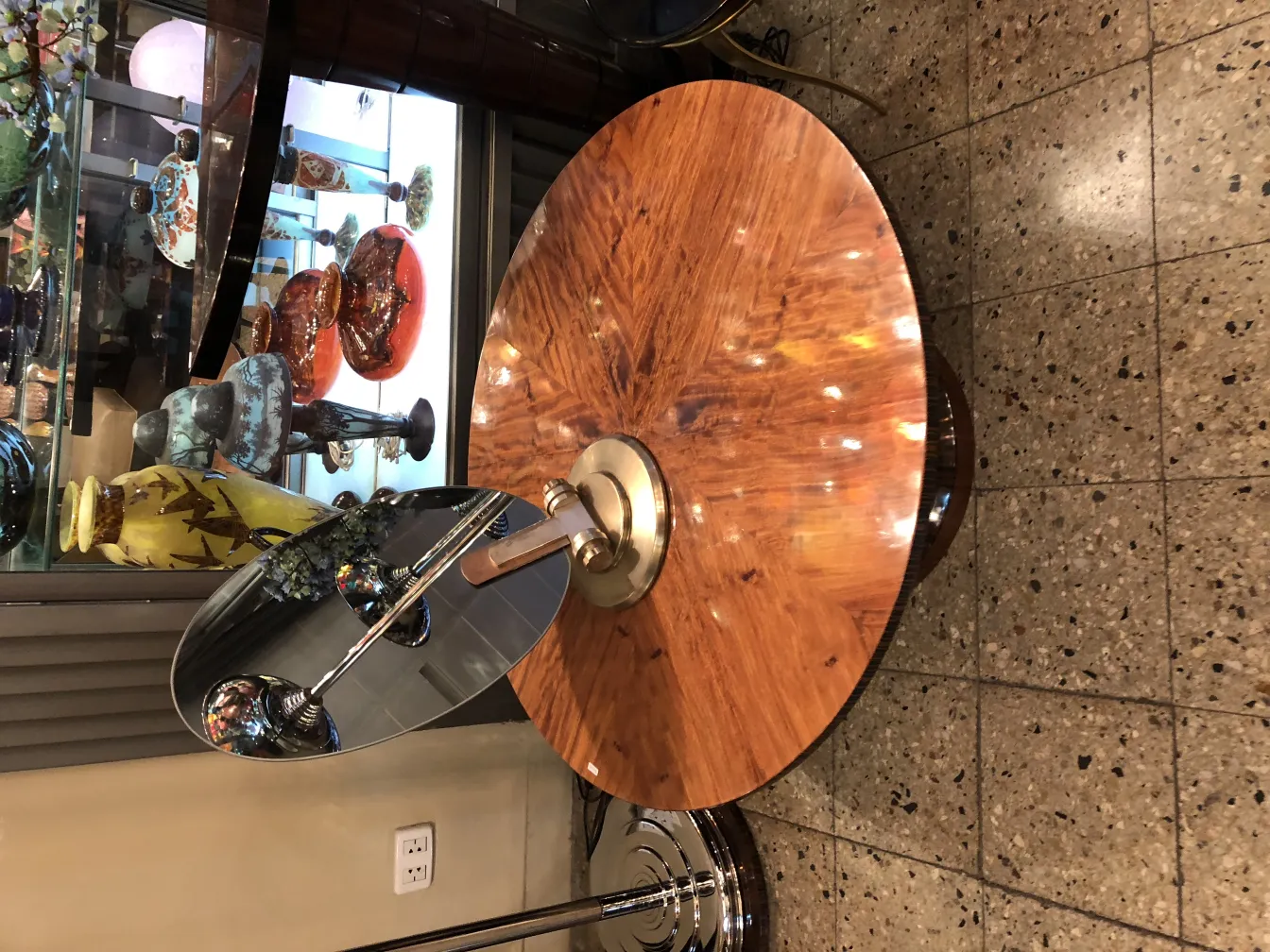 large antique mirror with round base in a vintage setting