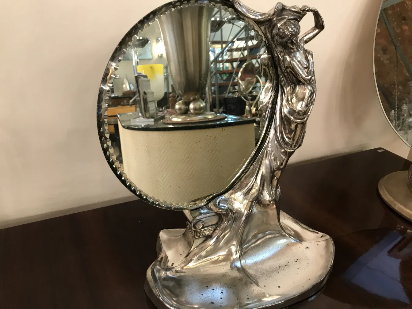 antique mirror with intricate design and artistic details