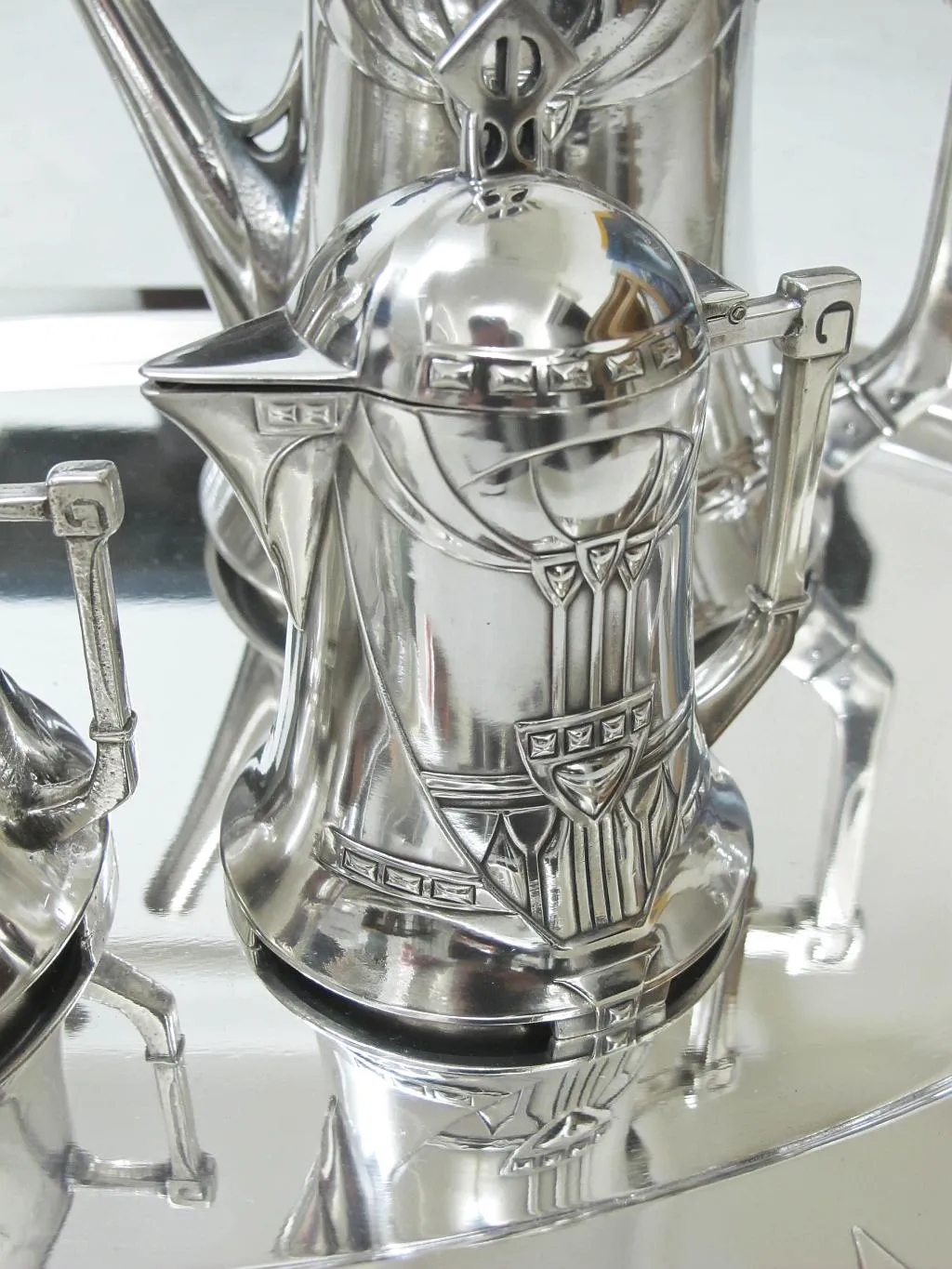 Antique WMF tea set in an elegant setting with intricate decorations and sophisticated design.