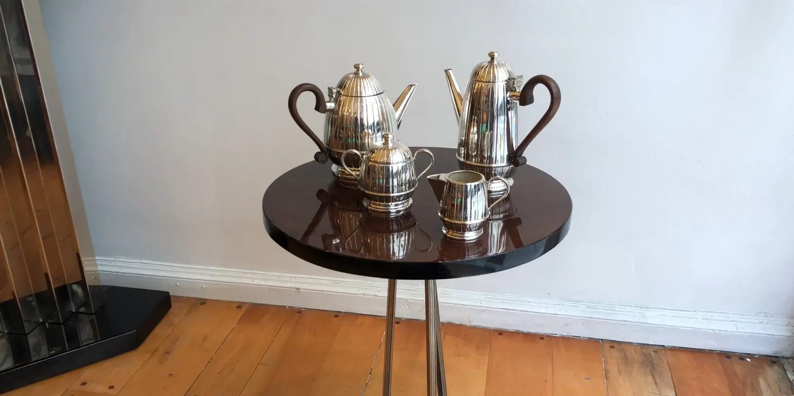 Antique tea set WMF displayed on a modern table with shine